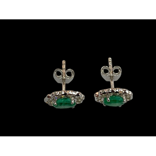 190 - Pair of 18 carat white gold, emerald and diamond cluster earrings, emeralds 0.93 carats, diamonds 0.... 