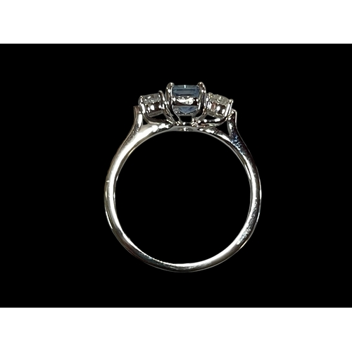 193 - Ceylon sapphire and diamond three stone ring set in 18 carat white gold, size O.