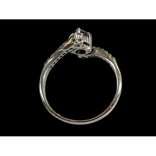 211 - Amethyst and sixteen stone diamond 18 carat white gold ring, size R.