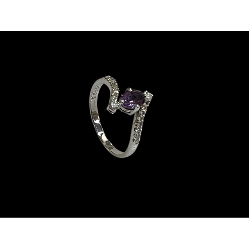 211 - Amethyst and sixteen stone diamond 18 carat white gold ring, size R.