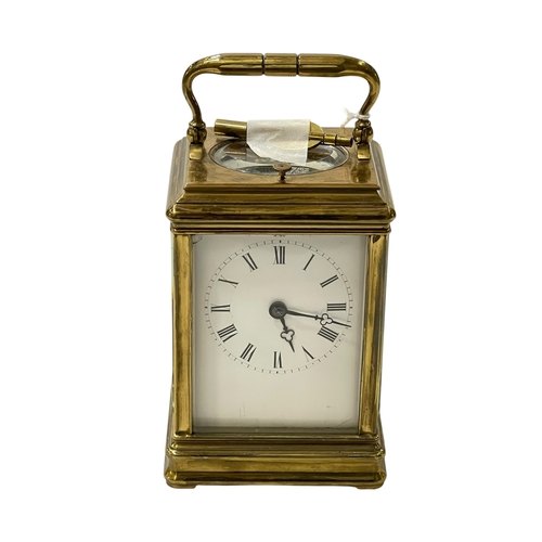 233 - Gilt brass repeater carriage clock, 16cm including handle.