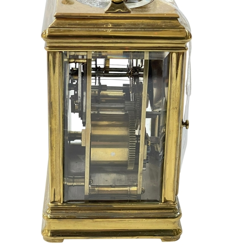 233 - Gilt brass repeater carriage clock, 16cm including handle.