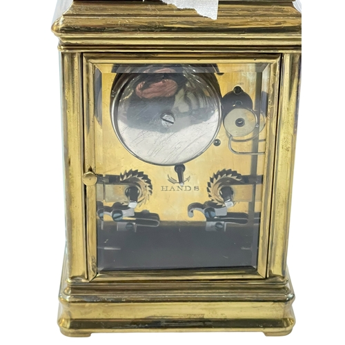 233 - Gilt brass repeater carriage clock, 16cm including handle.