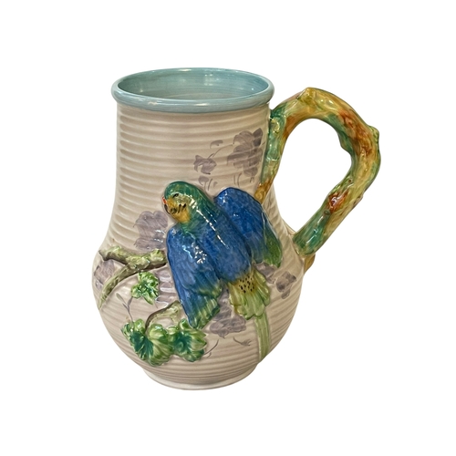 276 - Clarice Cliff Budgie jug, 22cm.