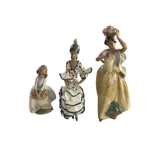 288 - Three boxed Lladro figures 'A Bird on Hand', 'Andalucian Dancer' and 'May Flowers'.