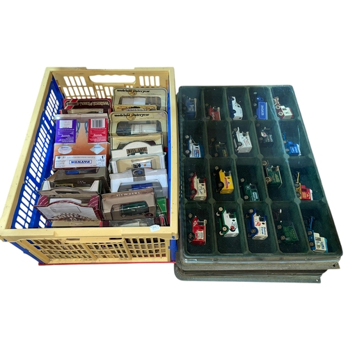 29 - Four boxes of model vehicles.