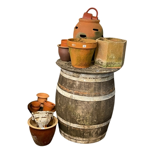 320 - Barrel table, terracotta strawberry pot, collection of garden planters, etc.