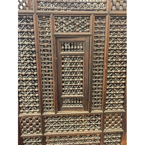 326 - Indian hardwood three fold confessional screen, 167.5cm.