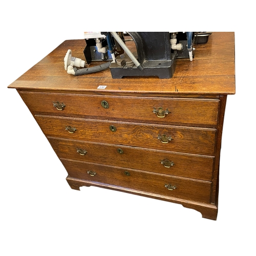 330 - Georgian oak chest of four long drawers and antique spinning wheel (2).