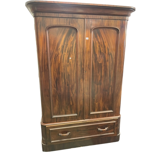 345 - Victorian mahogany double door wardrobe with base drawer, 203cm by 140cm by 63cm.