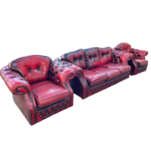 358 - Ox blood buttoned leather and studded three piece lounge suite.