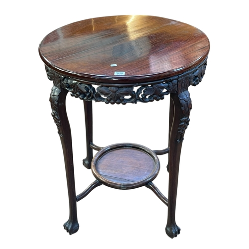 364 - Oriental rosewood circular occasional table with carved foliate frieze, 78.5cm by 61.6cm diameter.