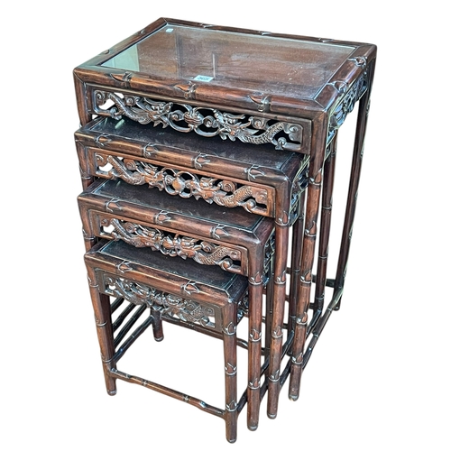 365 - Quartetto nest of four Oriental carved hardwood tables, largest 72cm by 51cm by 36cm.