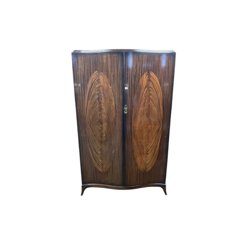 384 - Robson & Sons Ltd, Newcastle, mahogany two door serpentine front wardrobe and five drawer dressing t... 