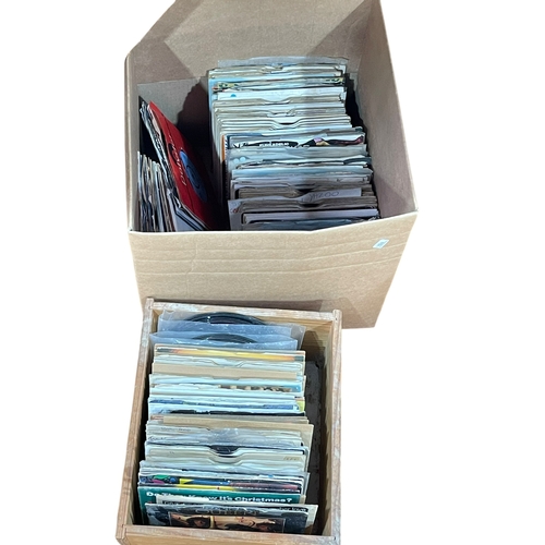 47 - Two boxes of singles.