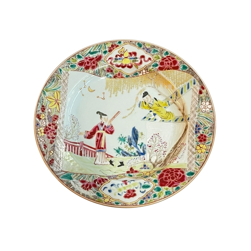 100 - Chinese Famille Rose plate decorated with figures in a landscape, 22cm.