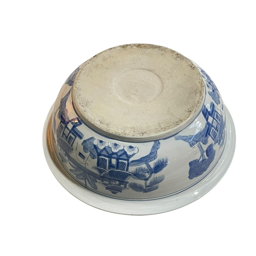 122 - Large Chinese blue and white pottery bowl with outer landscape and inner floral design, 36.5cm.