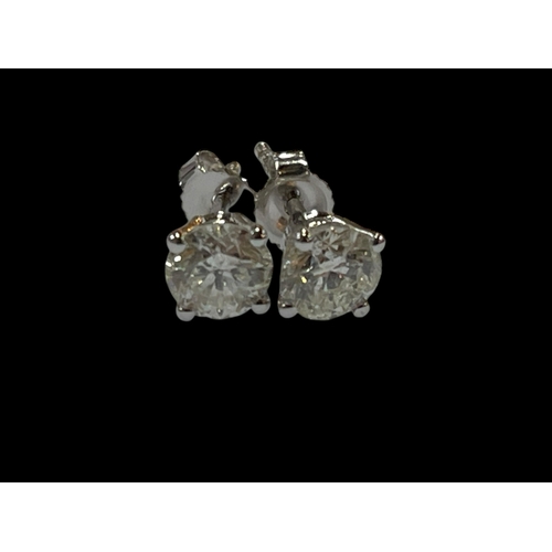 125 - Pair of 18 carat white gold and diamond stud earrings, diamond total 1.22 carats.