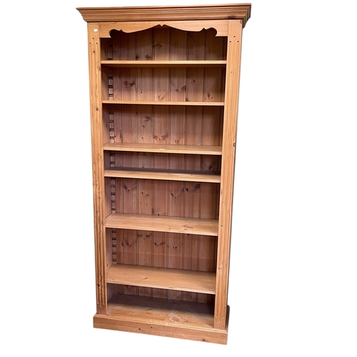 334 - Pine open bookcase having six adjustable shelves, 203cm by 97cm by 35.5cm.