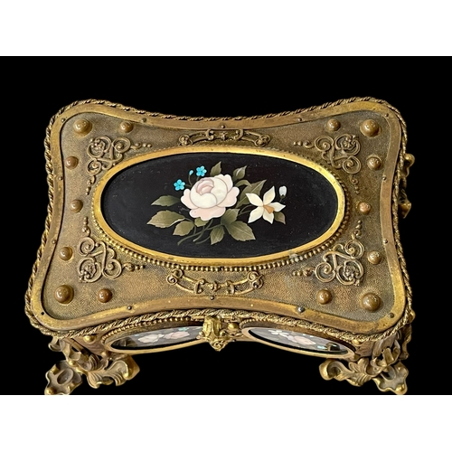 190 - Continental gilt casket with Pietra Dura oval panels, 16.5cm across at feet.