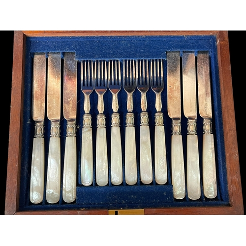 210 - Cased set of mother of pearl handled dessert knives and forks.