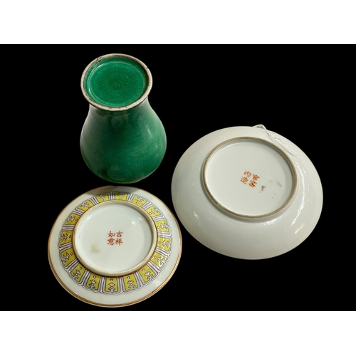 257 - Chinese green glazed baluster vase, 12.5cm, and two small plates (3).