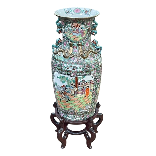 111 - Large pair of floor standing Cantonese famille rose vases with decorated panels on floral ground eac... 