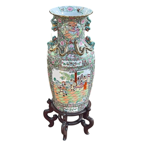 111 - Large pair of floor standing Cantonese famille rose vases with decorated panels on floral ground eac... 