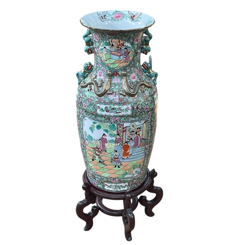 111 - Large pair of floor standing Cantonese famille rose vases with decorated panels on floral ground eac... 