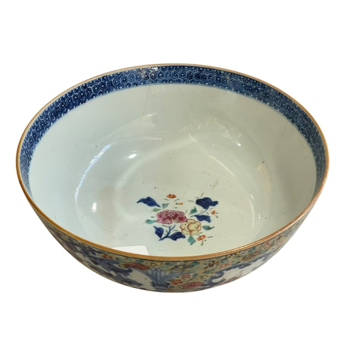 121 - Large Chinese famille rose bowl decorated with figural panels surrounded by flowers, 26cm diameter.