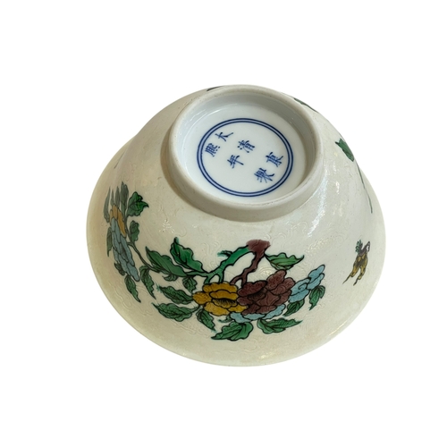 122 - Famille verté floral decorated Sancai bowl with Kangxi mark, 15cm diameter.