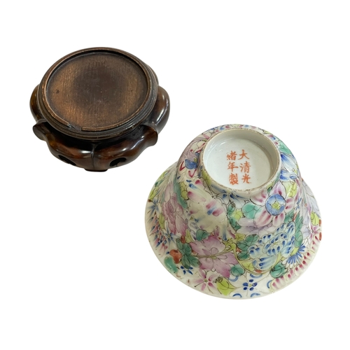 123 - Chinese famille rose floral decorated bowl on wood stand with Qianlong mark to base, height with sta... 