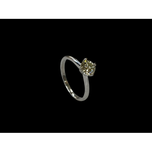 136 - Diamond claw set solitaire ring set in 18 carat white gold, the round cut diamond 0.80 carats, size ... 