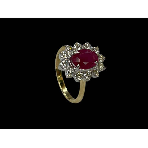 137 - 18 carat yellow and white gold oval ruby and diamond cluster ring, the 2.20 carat oval ruby surround... 