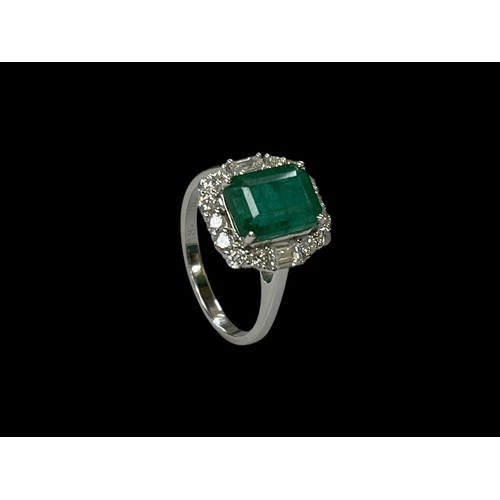 138 - Emerald and diamond cluster ring set in 18 carat white gold, the rectangular 3 carat baguette cut em... 