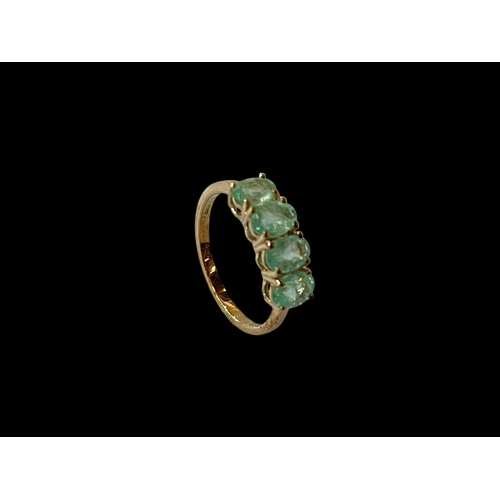 201 - Emerald four stone 9 carat gold ring, size N/O.