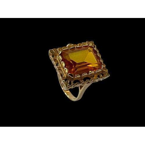 209 - 9 carat gold, probably synthetic orange sapphire ring, size Q.