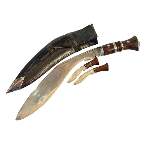 259 - Kukri knife and scabbard with its two smaller knives.