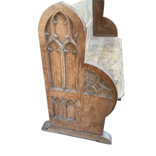 321 - Oak Gothic style church pew, 92cm by 122cm by 55cm.