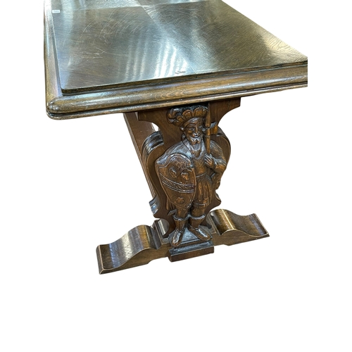 336 - Rectangular oak coffee table raised on carved figural Knight supports joined by stretcher, 57cm by 1... 