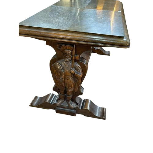 336 - Rectangular oak coffee table raised on carved figural Knight supports joined by stretcher, 57cm by 1... 