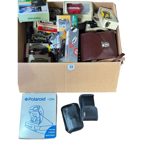 33 - Collection of model vehicles, cameras and horsebrasses.