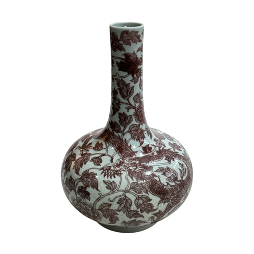 137 - Chinese bulbous vase decorated with copper red dragon and floral design, 28cm, Qianlong seal mark to... 