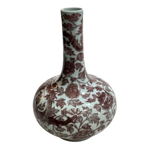 137 - Chinese bulbous vase decorated with copper red dragon and floral design, 28cm, Qianlong seal mark to... 