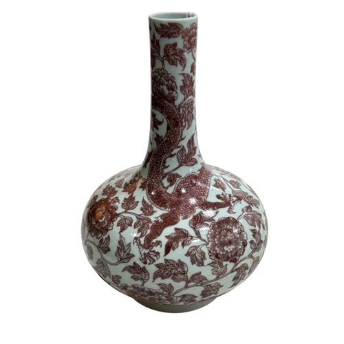 137 - Chinese bulbous vase decorated with copper red dragon and floral design, 28cm, Qianlong seal mark to... 