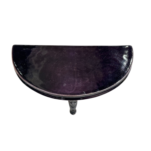 148 - Chinese porcelain demi lune stand raised on three face mask and paw feet, 26cm by 14cm.