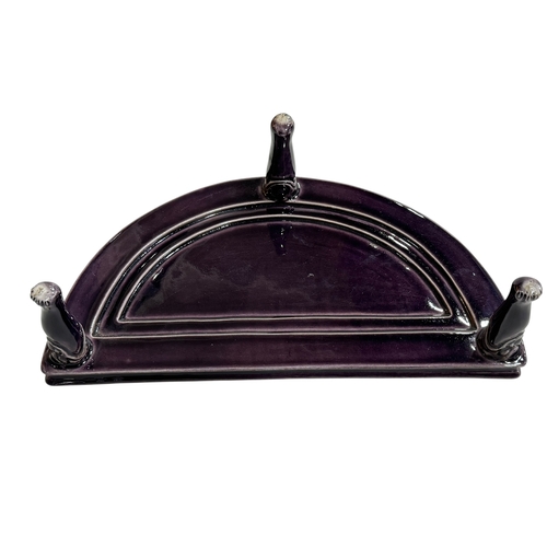 148 - Chinese porcelain demi lune stand raised on three face mask and paw feet, 26cm by 14cm.