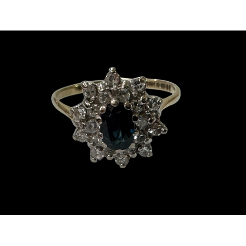 182 - Sapphire and diamond cluster 9 carat gold ring, size N.