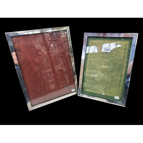245 - Two silver mounted rectangular easel photograph frames.