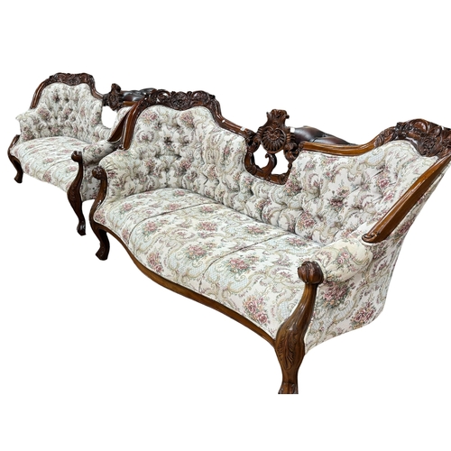 311 - Pair Victorian style three seater settees in buttoned floral tapestry fabric.